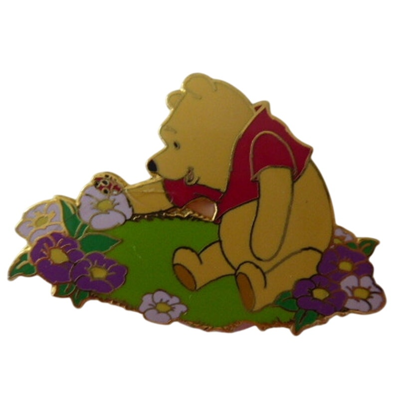 DLR - Pooh sitting in flower garden