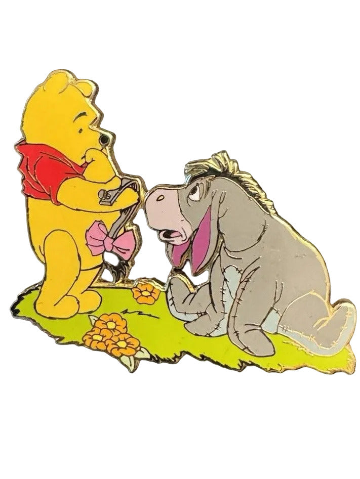 Pooh Holding Eeyore's Tail