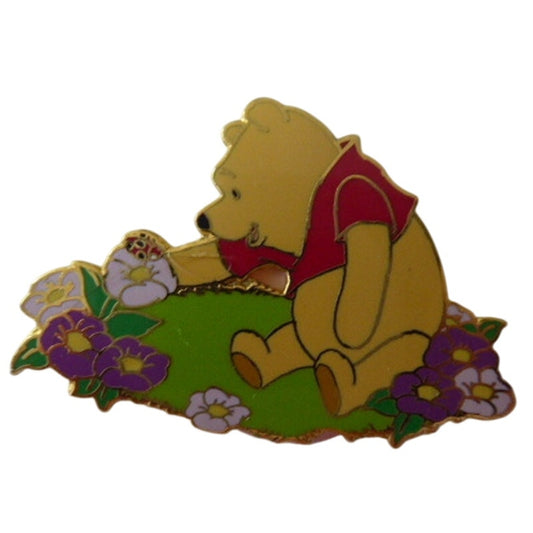 DLR - Pooh sitting in flower garden
